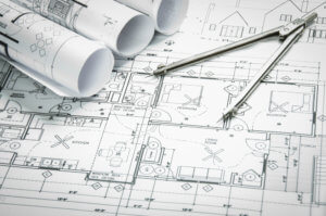 Architectural,Blueprints,And,Blueprint,Rolls,And,A,Drawing,Instruments,On